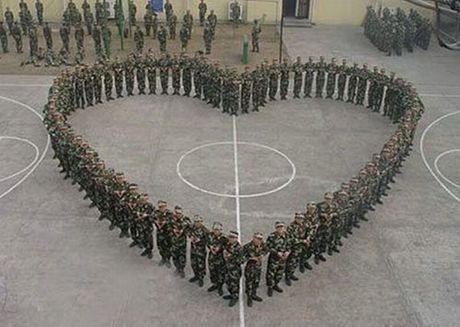 Performative Practices Of Our Time, 2017. Soldiers stand in a heart-shaped formation ahead of Valentine’s Day