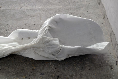 Michael E. Smith, Untitled, 2013, animal feed scoop, pillow case, magnets, plastic, 12 x 77 x 18 cm