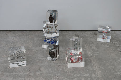 Cady Noland, 8 objects (bullets, handgranades, coke and beer cans), encased in plexicubes, 1986