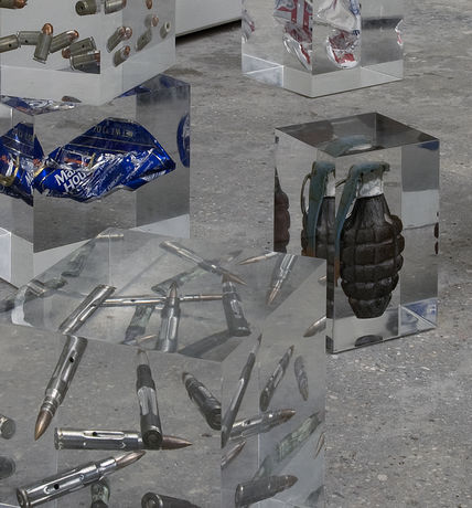 Cady Noland, 8 objects (bullets, handgranades, coke and beer cans), encased in plexicubes, 1986